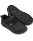 Zapatilla escolar barefoot negra modelo Dash con doble velcro para kids vista par con suela