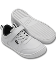 Zapatilla escolar barefoot blanca modelo Dash con doble velcro para kids vista par con suela
